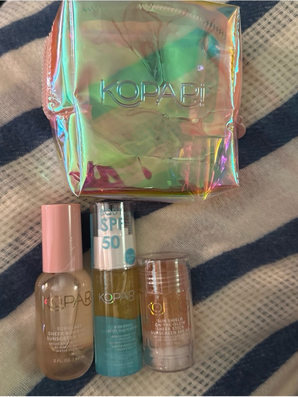 Kopari Sunscreen Trio with Pink Caps and Iridescent Pouch